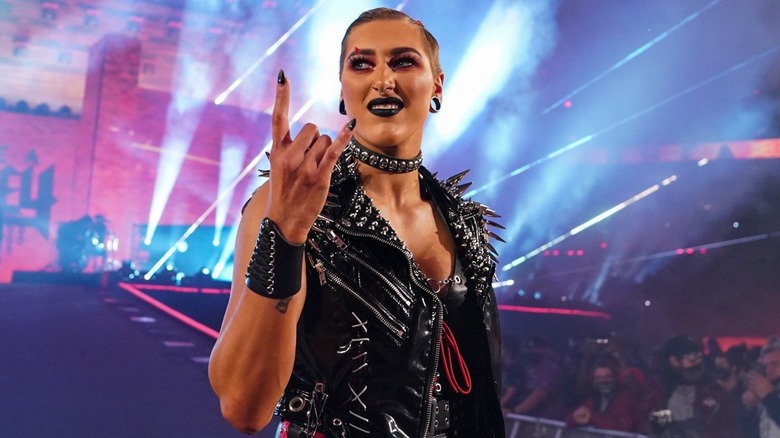 Rhea Ripley posing with the devil horns