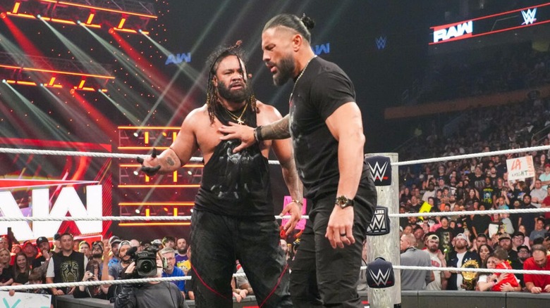 World Heavyweight Champion Roman Reigns holds Jacob Fatu back, as he goes to attack LA Knight, during the main event segment of the August 17, 2026 edition of 