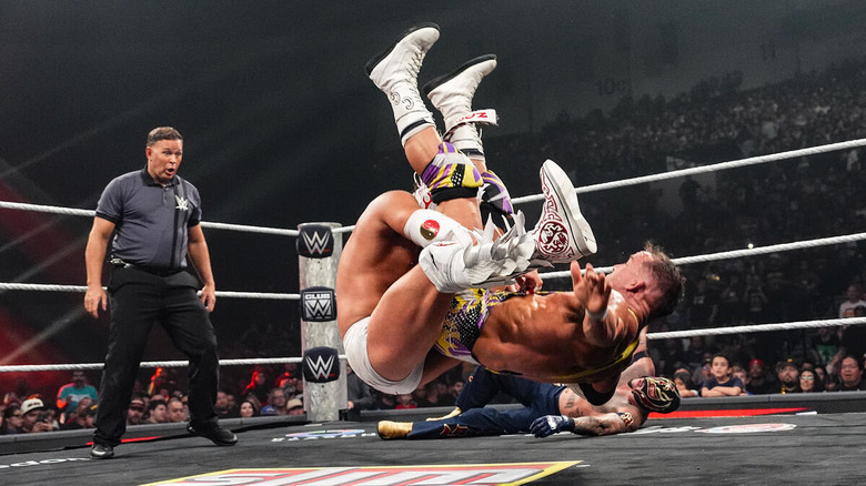 Dragon Lee hits a powerbomb on Chad Gable in front of a fallen Rey Mysterio in the ring on "WWE Raw"