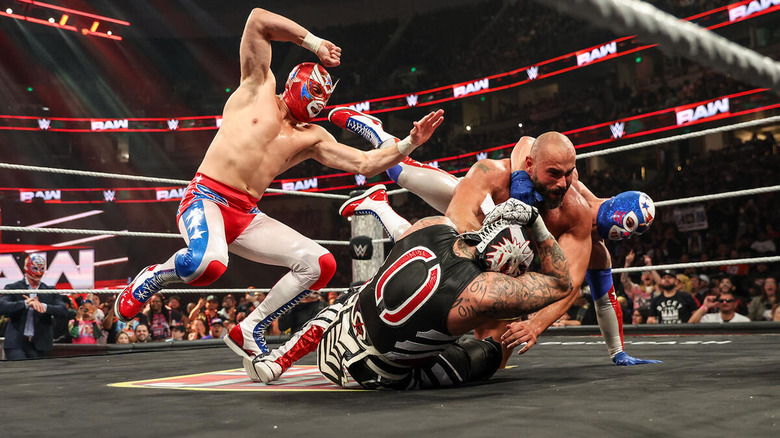 Los Americanos attack Penta and Rusev during their match on "WWE Raw."