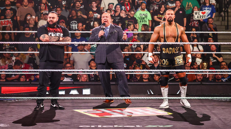 Bron Breakker and Bronson Reed stand on either side of Paul Heyman in the ring on "WWE Raw"