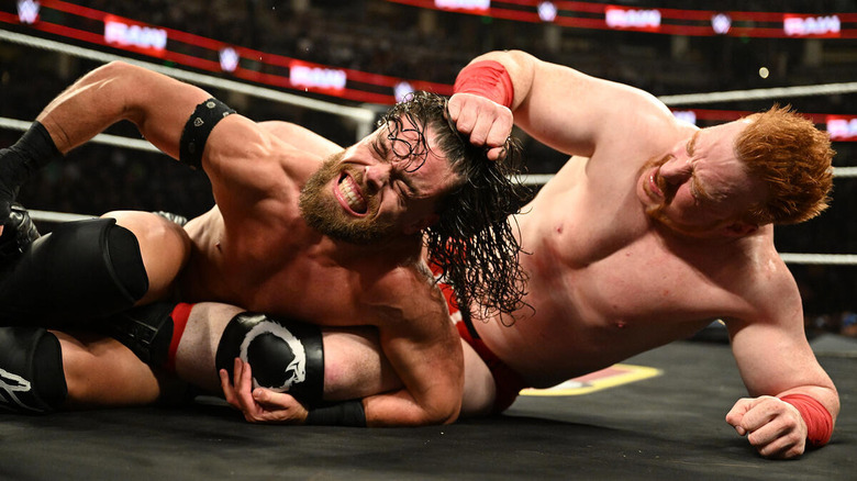 Sheamus wrestling JD McDonagh on the mat on "WWE Raw"