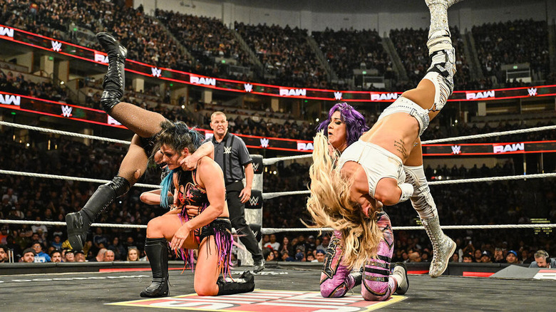 Alexa Bliss and Charlotte Flair hit stereo Natural Selections on Bayley and Lyra Valkyria on "WWE Raw"