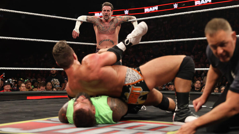CM Punk watches as LA Knight pins Jey Uso on "WWE Raw"