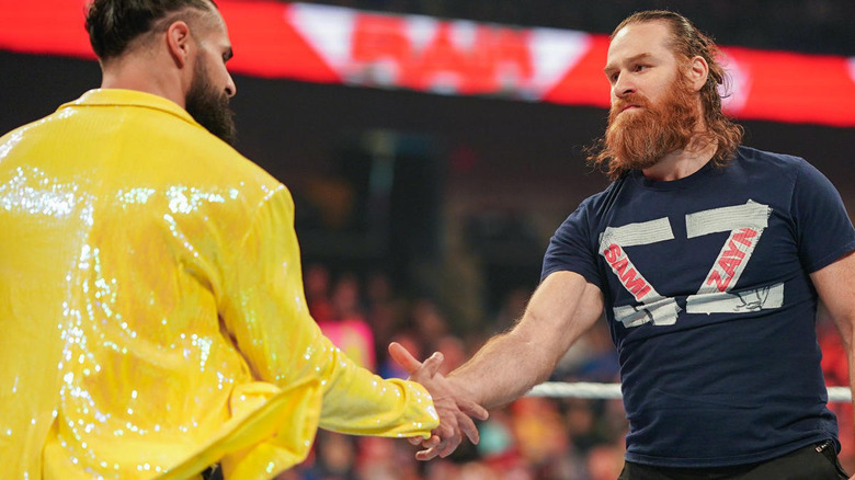Seth Rollins and Sami Zayn shaking hands