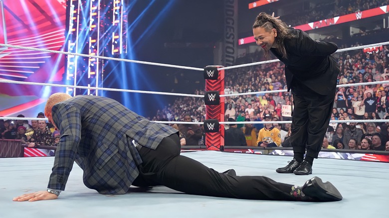 Shinsuke Nakamura stands over Cody Rhodes