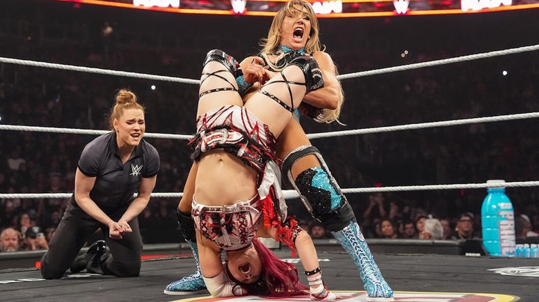 Charlotte Flair locks IYO SKY in a Boston Crab on "WWE Raw"