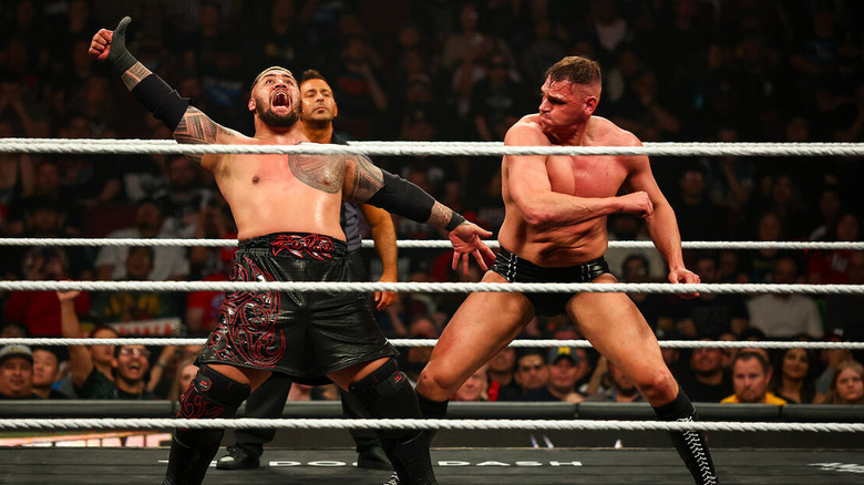 Solo Sikoa prepares to spike GUNTHER while GUNTHER prepares to chop Sikoa on "WWE Raw"