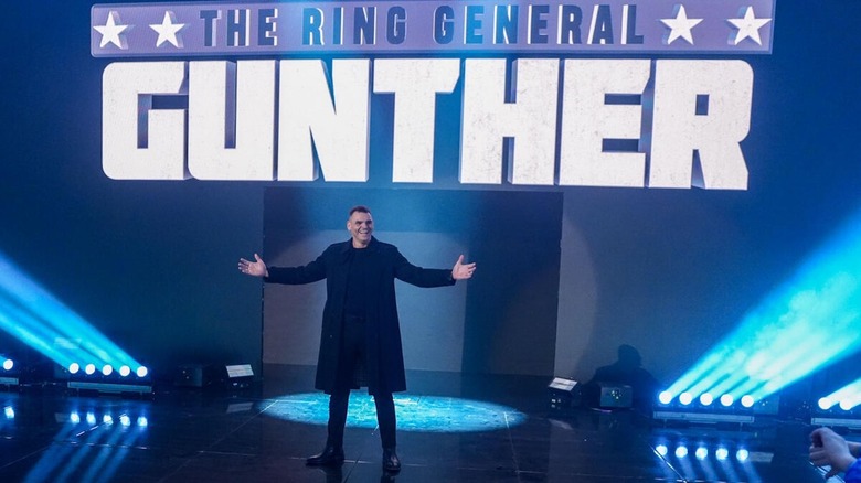 GUNTHER poses on the stage and laughs on "WWE Raw"
