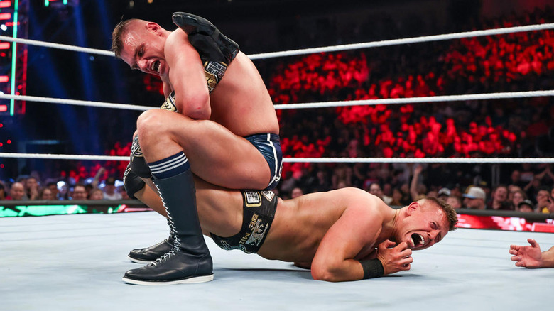 GUNTHER with a submission hold on The Miz