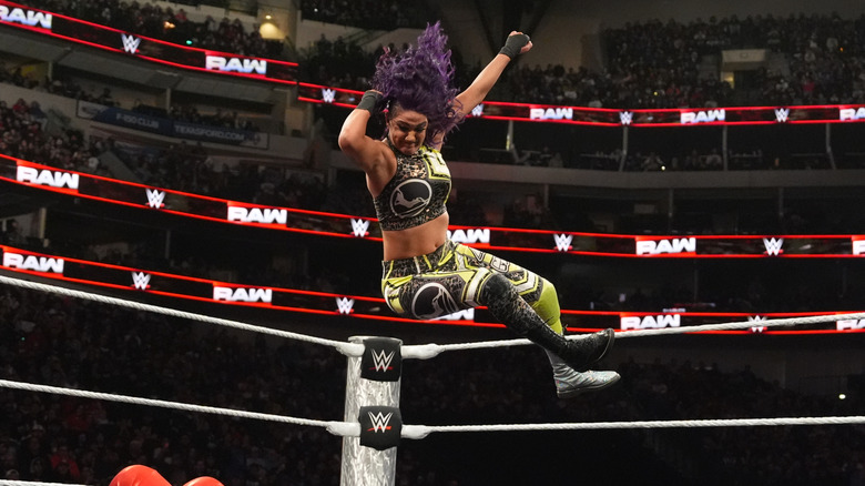 Bayley performs an Elbow Drop