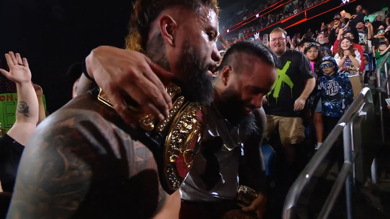 The Usos celebrate winning the World Tag titles
