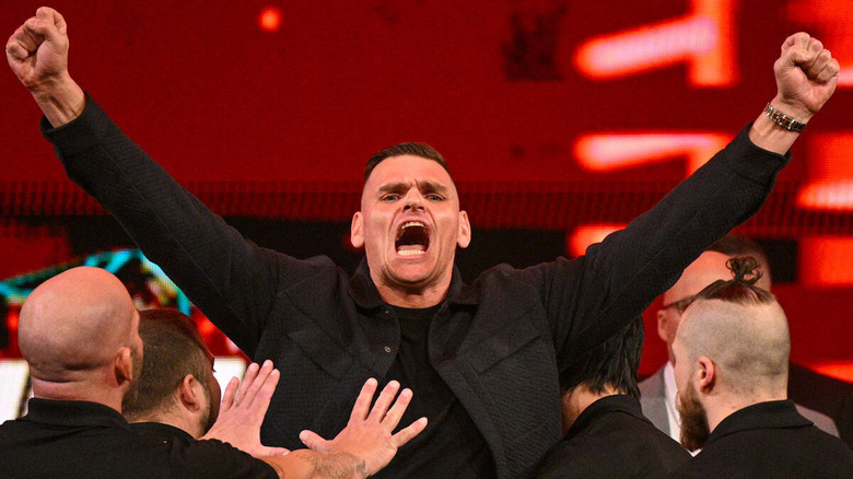 GUNTHER raises his fists on "WWE Raw"