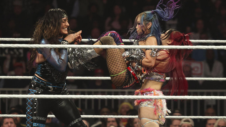 Raquel Rodriguez, Kairi Sane, and IYO SKY wrestling on "WWE Raw"