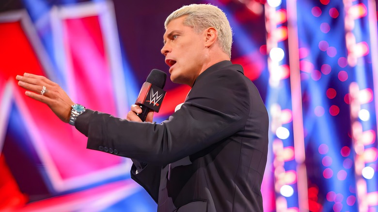  Cody Rhodes speaking into microphone