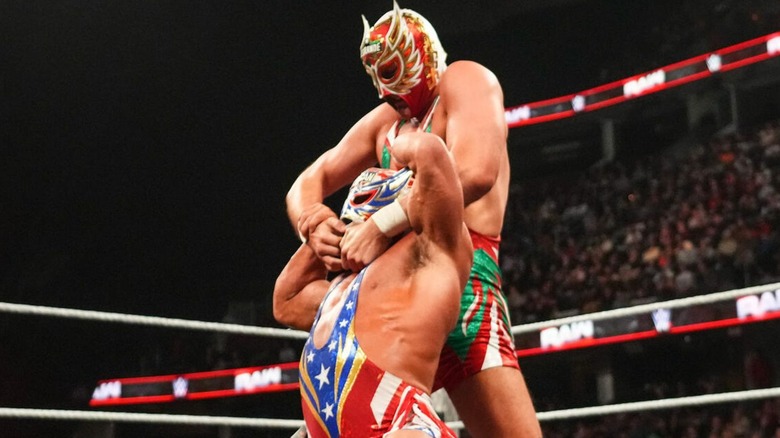 Ludwig Kaiser, El Grande Americano, tries to pull off the mask of Chad Gable, the Original El Grande Americano, in the middle of the ring during a match.