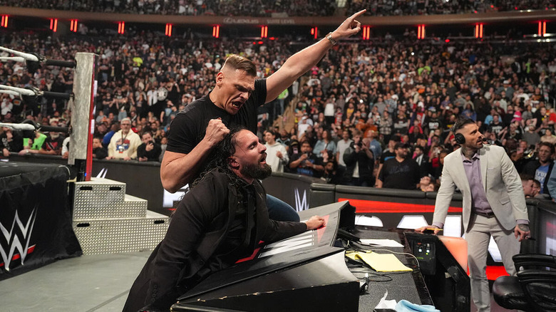 GUNTHER points while holding Seth Rollins by the hair on "WWE Raw"