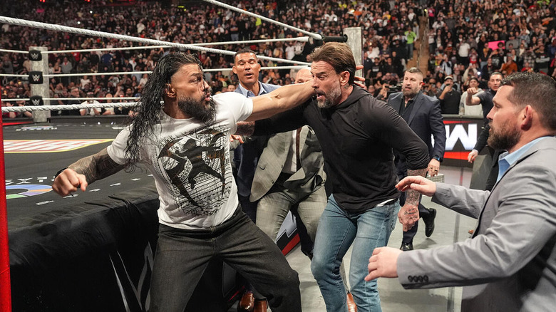 Roman Reigns brawls with CM Punk on "WWE Raw"