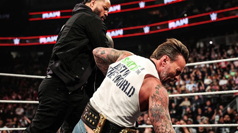 Jimmy Uso punching CM Punk on "WWE Raw"