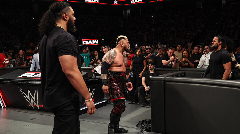 Solo Sikoa and Talla Tonga stare at Tama Tonga on "WWE Raw"
