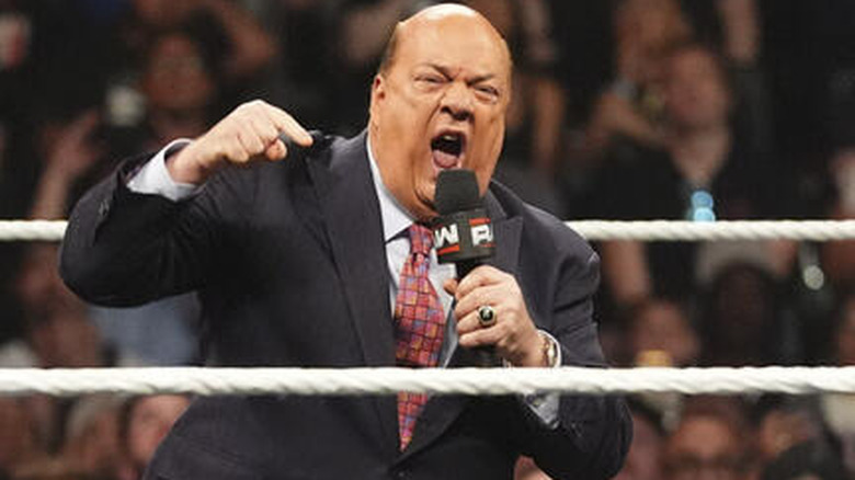 Paul Heyman screaming into a microphone