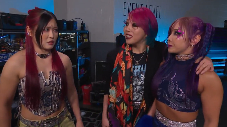 Iyo Sky, Asuka, and Kairi Sane in a backstage segment