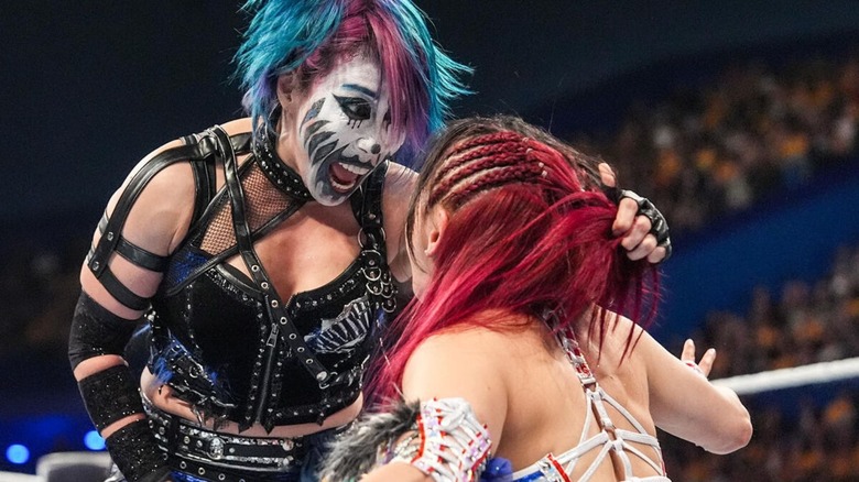 Asuka yells in the face of IYO SKY during a tag team match at Crown Jewel 2025.