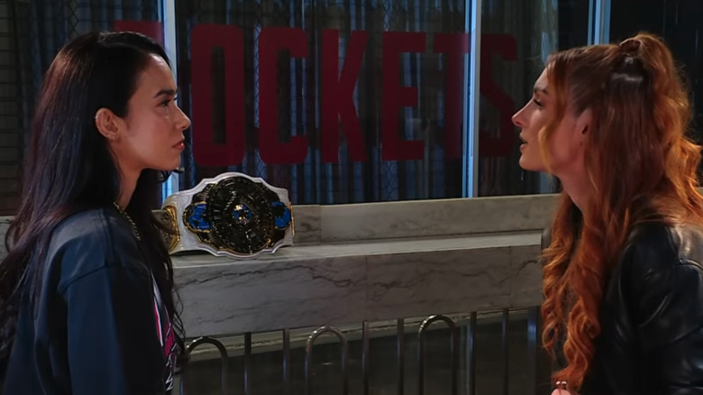 Becky Lynch and AJ Lee sit across from one another backstage on "WWE Raw"