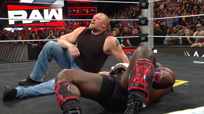 Brock Lesnar sits next to Oba Femi