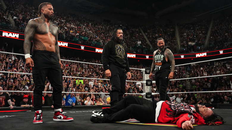 Roman Reigns and the Usos stand over a fallen Jacob Fatu on "WWE Raw"