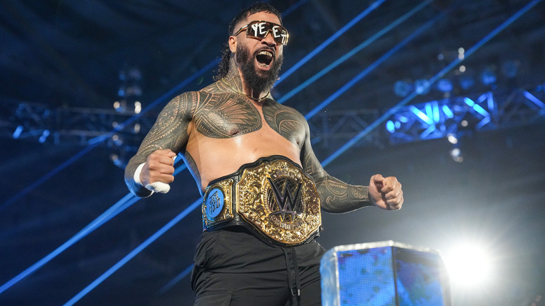Jey Uso poses while wearing the World Heavyweight Championship on "WWE Raw"