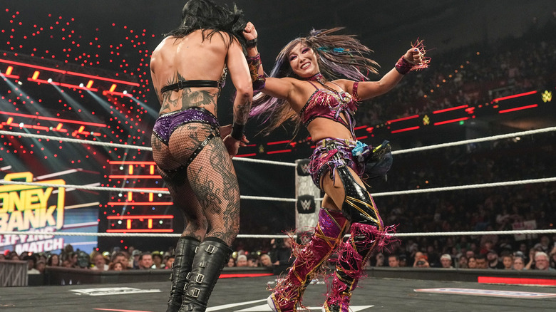 Kairi Sane hits Rhea Ripley with a spinning backfist on "WWE Raw"