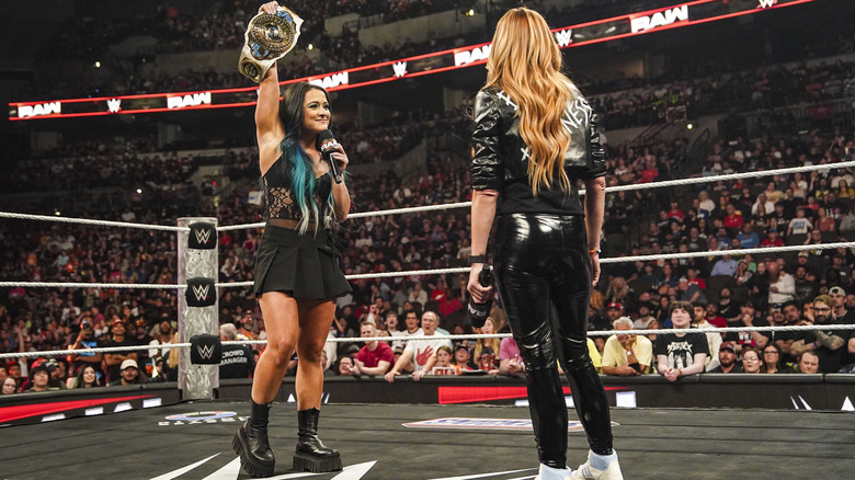 Lyra Valkyria holds on women's IC title while speaking to Becky Lynch via microphone on "WWE Raw"