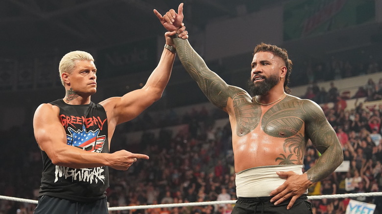 Cody Rhodes lifts Jey Uso's arm on "WWE Raw"