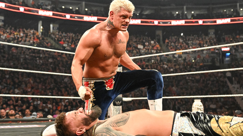 Cody Rhodes kneels before a fallen Jey Uso on "WWE Raw"