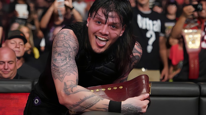 Dominik Mysterio sticks out his tongue