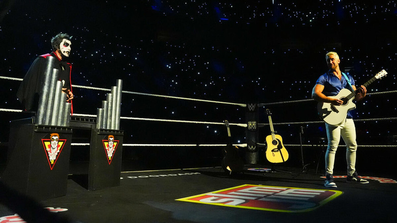 Danhausen and Joe Hendry in the ring with musical instruments on "WWE Raw"