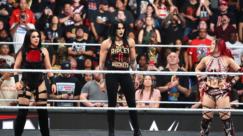 Stephanie Vaquer, Rhea Ripley, and IYO SKY Celebrate in the ring during Monday Night RAW at Toyota Center on July 21, 2025 in Houston, Texas.