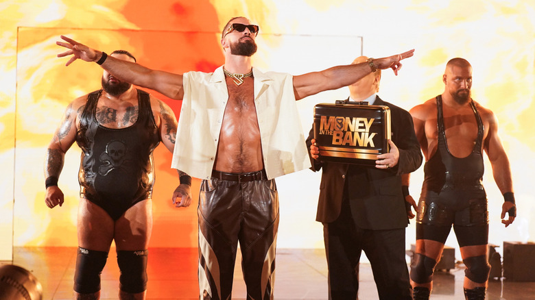 Seth Rollins poses with Bronson Reed, Paul Heyman, and Bron Breakker on "WWE Raw"