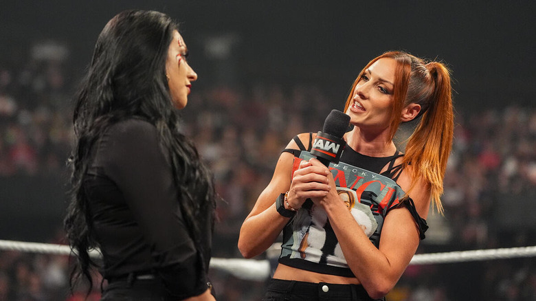 Becky Lynch speaking to Stephanie Vaquer on the microphone on "WWE Raw"