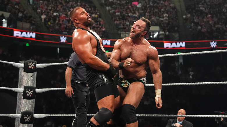 Bron Breakker and LA Knight wrestle one another