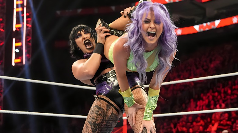 Rhea Ripley with a submission hold on Candice LeRae