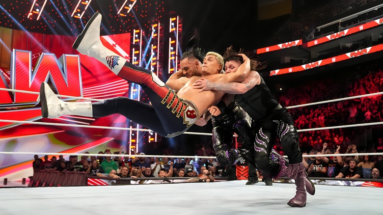 Cody Rhodes hits the Cody Cutter on Damian Priest and Dominik Mysterio