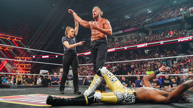 Referee raises Big Cass' arm as he stands over a fall Je'Von Evans on "WWE Raw"