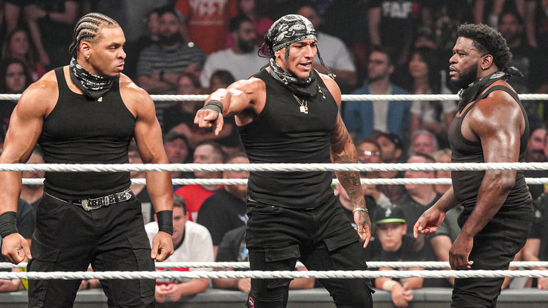 Lucien Price, Bronco Nima, and Royce Keys standing in the ring on "WWE Raw"