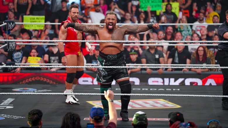 Solo Sikoa poses in the ring with LA Knight behind him on "WWE Raw"