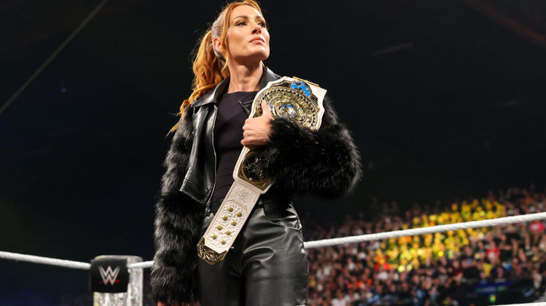 Becky Lynch proudly holds her Women's Intercontinental Championship during an in-ring promo segment.