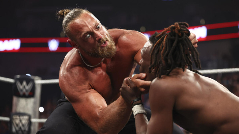 Big Cass grabbing the face of Je'Von Evans on "WWE Raw"