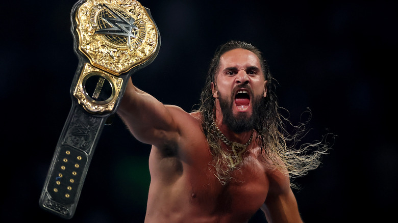 Rollins holding up the World Heavyweight Championship belt