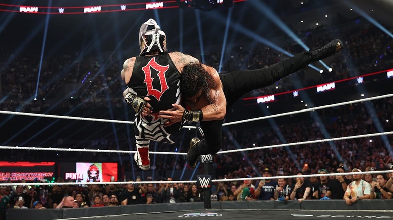 Roman Reigns spears Penta in the ring on "WWE Raw"
